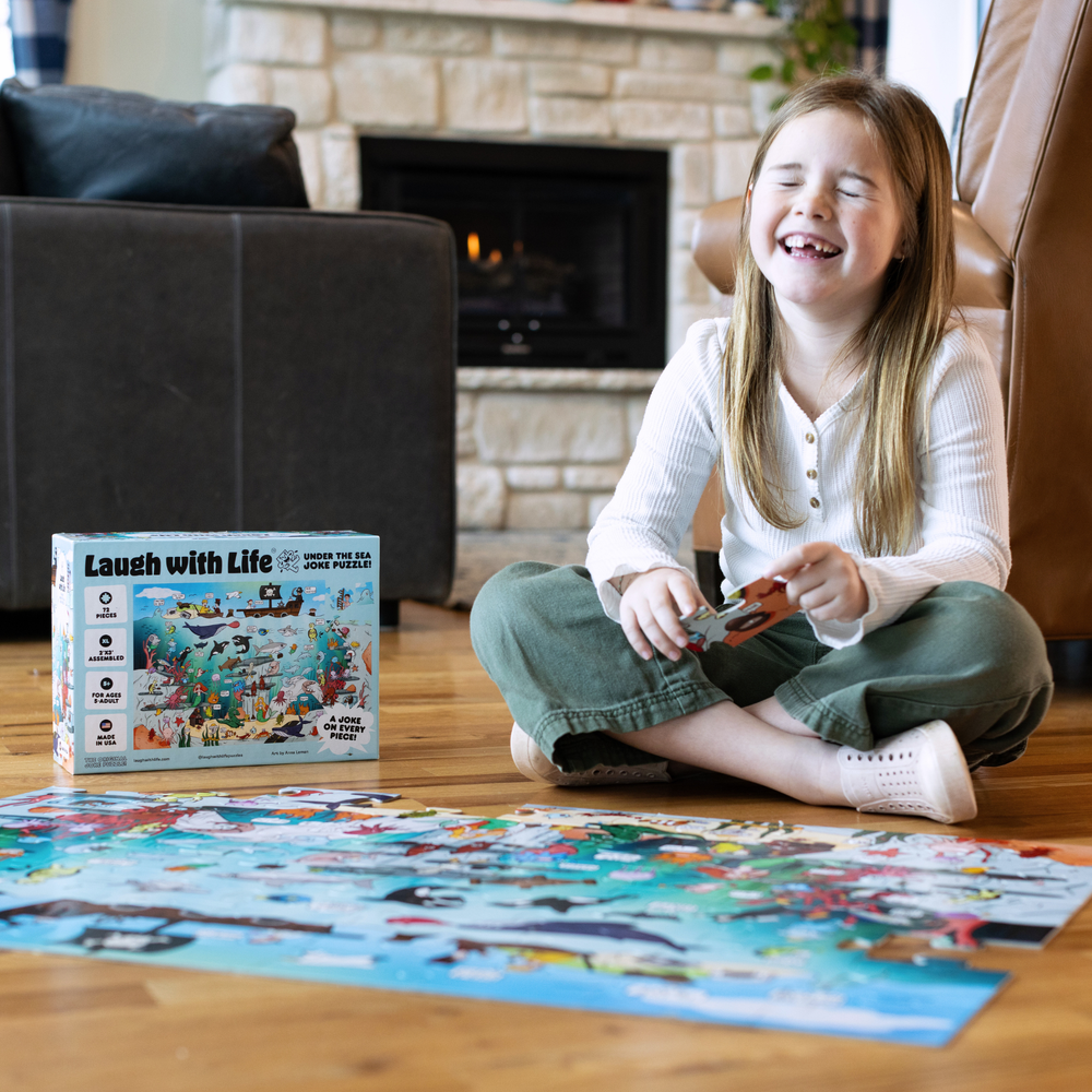 Child enjoying a Livuzzle conversation starter jigsaw puzzle with trivia and jokes, a fun family puzzle designed for laughter and learning.
