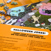 Halloween-themed puzzle with jokes lying on the corresponding Halloween Joke Puzzle