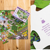 side by side images showing a whole Animal Joke Puzzle nearly completed, as well as a close up shot of the back of one of the large puzzle pieces, which shows a joke printed on the back of the puzzle piece