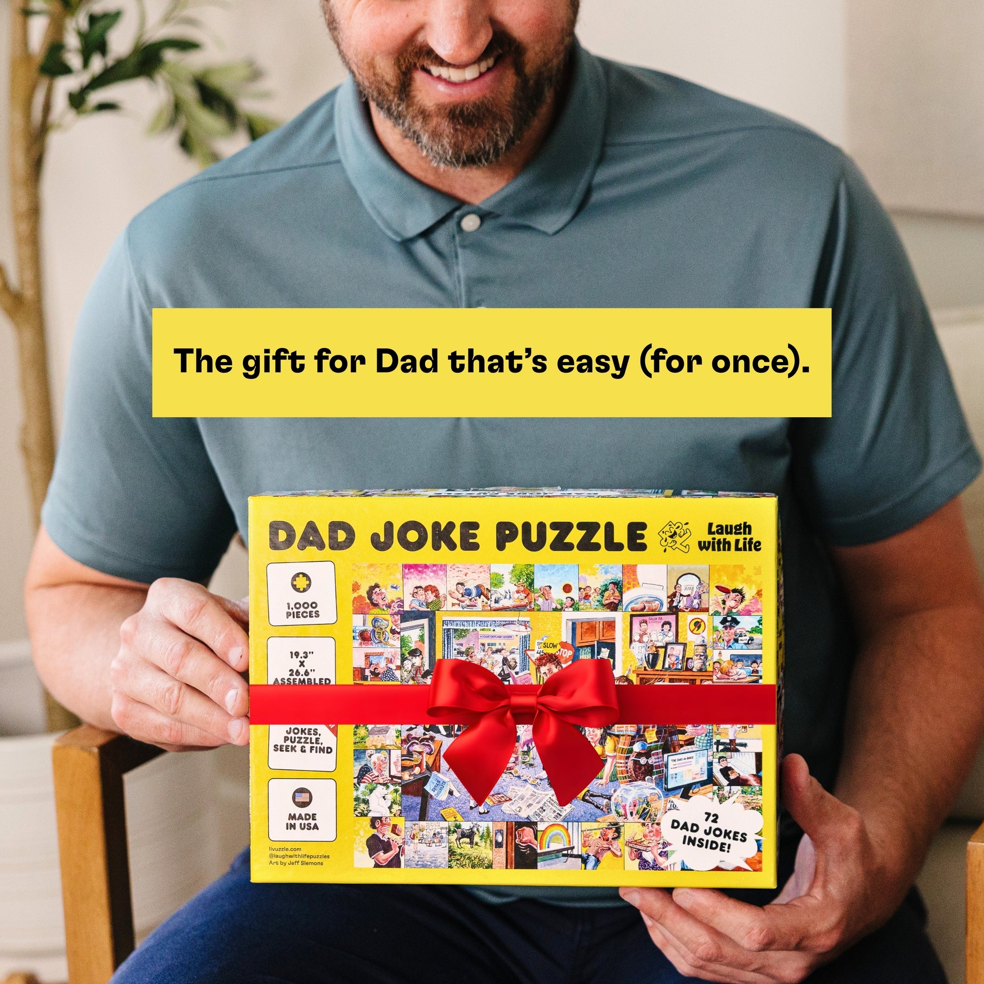 Man holding a 'Dad Joke Puzzle' box with a red bow, text overlay 'The gift for Dad that's easy (for once).'