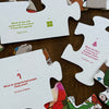 Image showing the backs of the puzzle pieces, which have Christmas jokes printed on them