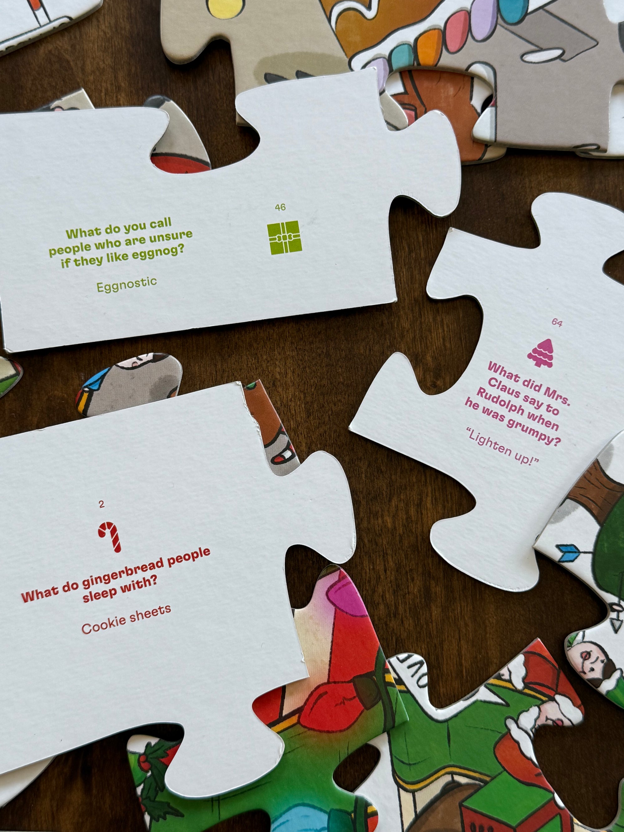 Image showing the backs of the puzzle pieces, which have Christmas jokes printed on them