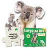 Jigsaw puzzle of a koala with a box labeled 'Large as Life' on a white background